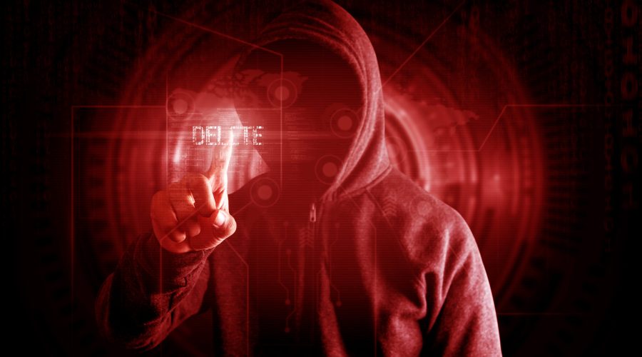 Hackers touch delete button to delete data Virus attack concept, red tone.